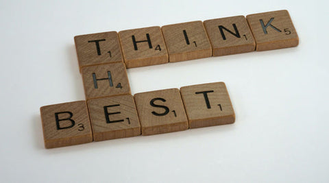Scrabble pieces that say "think the best"