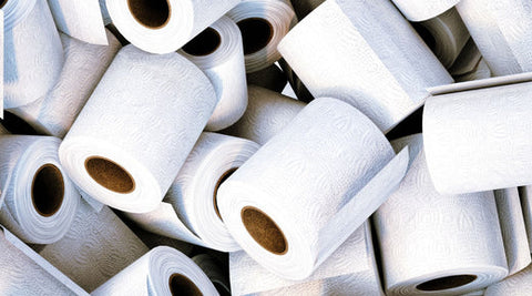Bamboo toilet paper rolls in a large pile