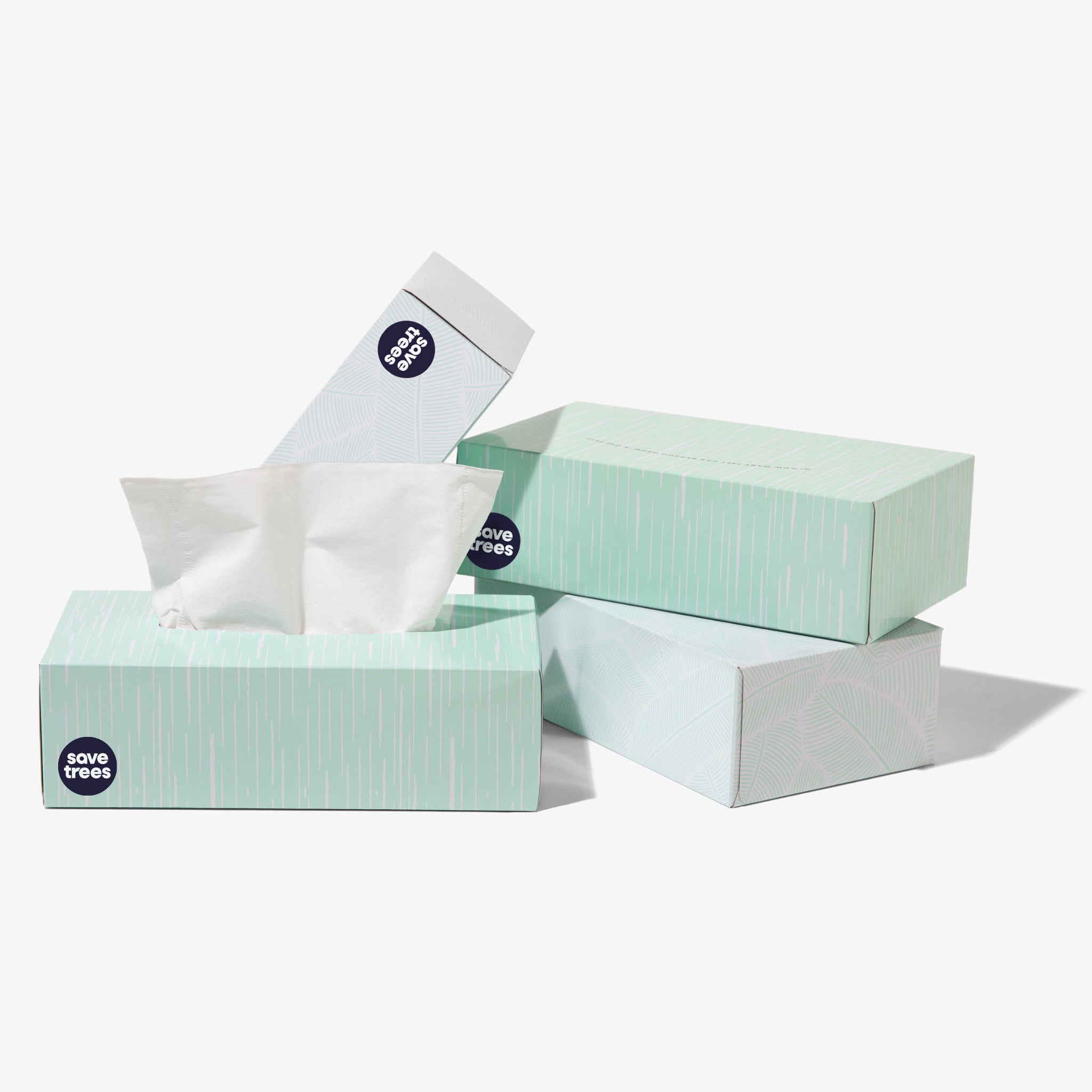 A trio of bamboo tissue boxes, each adorned with Save Trees label
