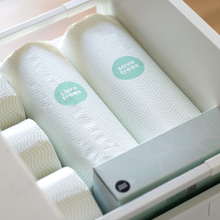 Load image into Gallery viewer, An open drawer filled with Save Tree&#39;s bamboo paper towels, organized and ready for use in a bathroom setting
