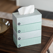 Load image into Gallery viewer, 4 boxes of Save Trees&#39; bamboo facial tissues stacked on coffee table
